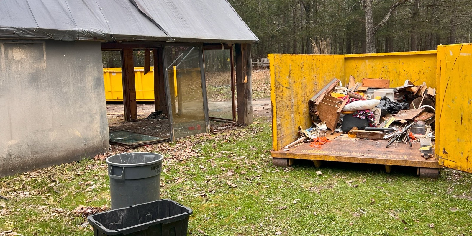 Roll-off dumpster loaded with construction and household debris